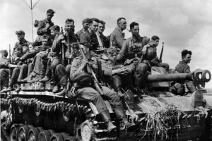 Soldiers of the GroBdeutschland hitch a ride on an Assault Gun